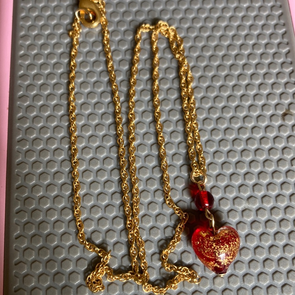 14k gold pendant on a gold chain